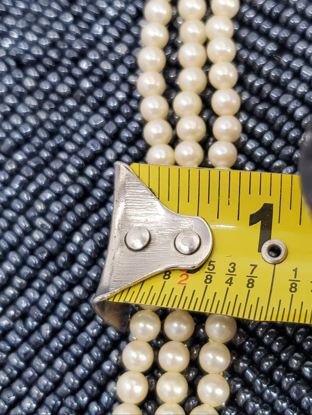 Vintage-style 3-strand pearl choker necklace with a prominent cameo centerpiece